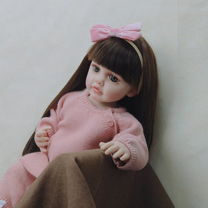 Bebe Reborn Menina De Cabelos Compridos Em Vestido Rosa, Olhos Abertos - 55Cm/22"